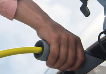 An EV charger plugged into a car.