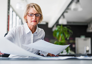 A woman looking at papers