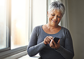 woman looking at smartphone