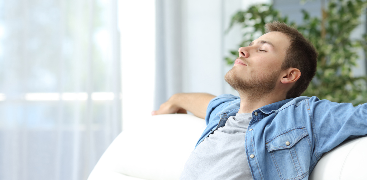  man relaxing on a couch