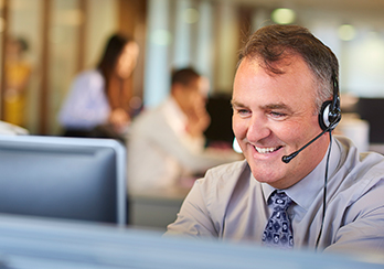 Man in a call center wearing phone headset