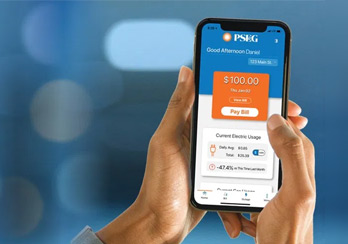  A man sitting at a table using a tablet device