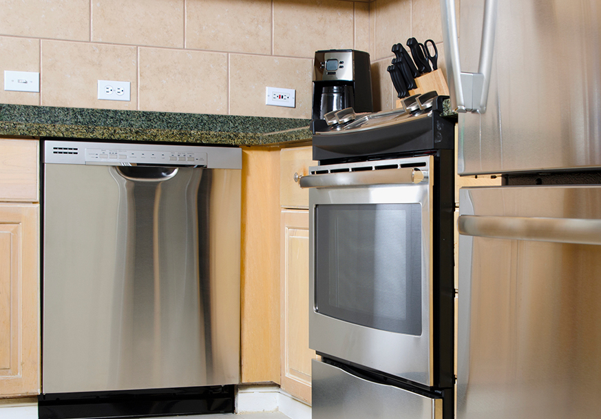 Stainless steel dishwasher and stove installed in a kitchen
