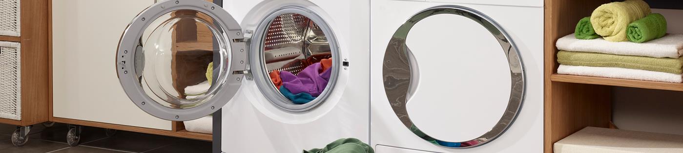 A front-loading washing machine with a basket of laundry in front